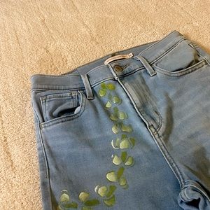 Levi’s high rise super skinny jeans - hand painted puakenikeni lei on front left